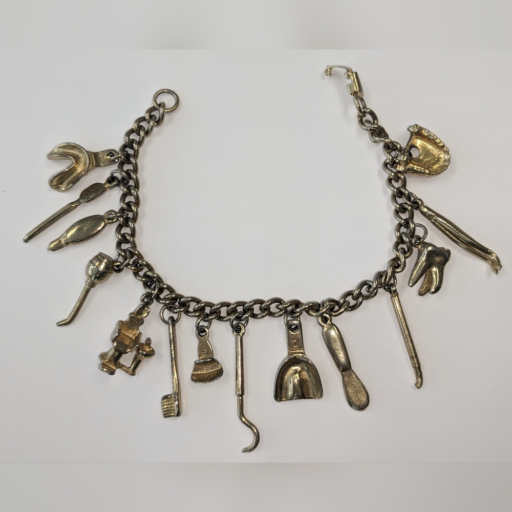 VTG HEAVY GOLD TONE DENTAL TOOL CHARM BRACELET